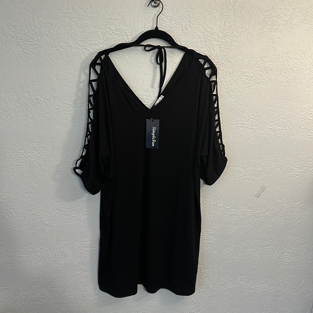 Black swim cover up with V neck in the front and back plus a tie in the back.